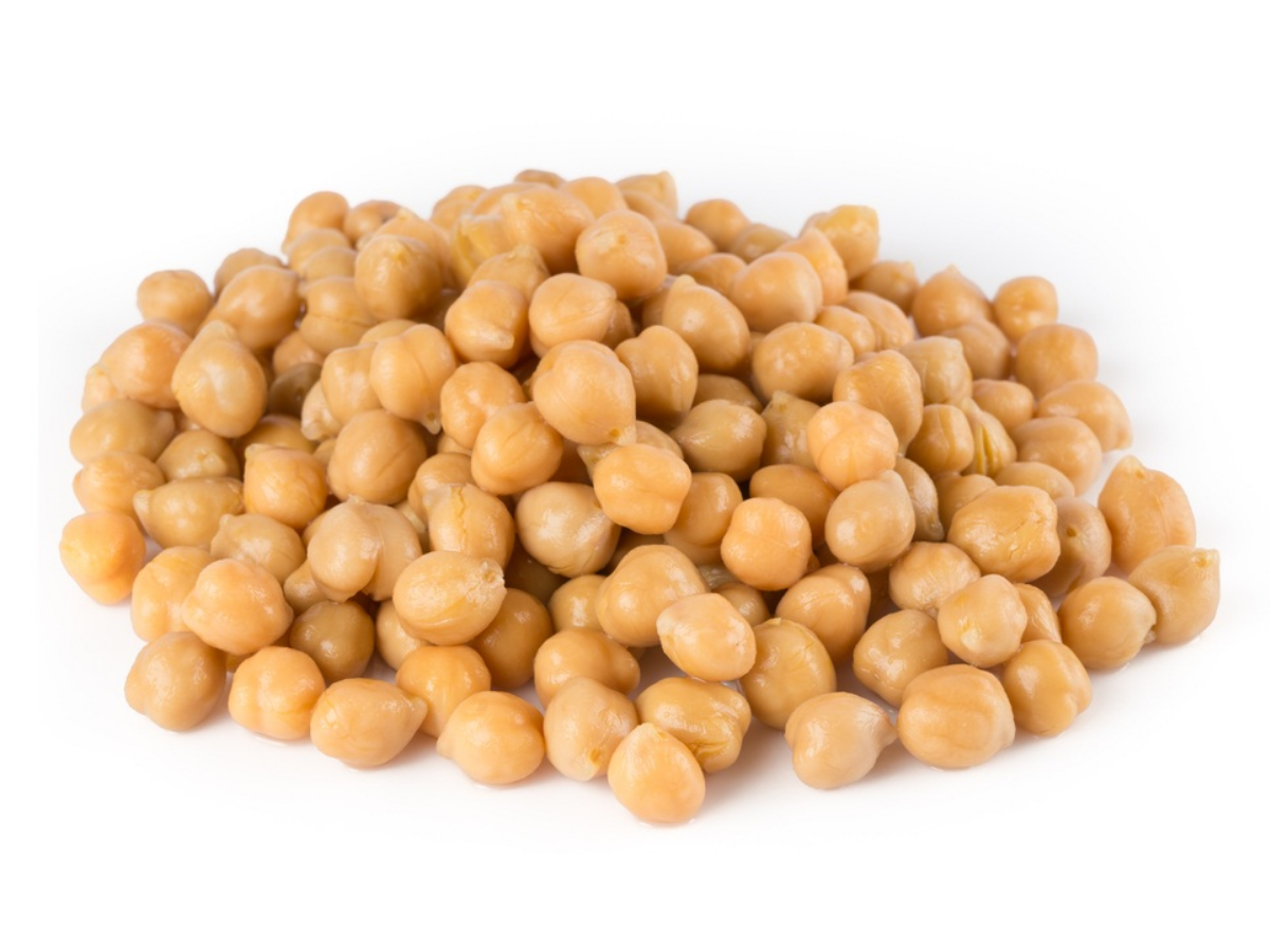 a pile of chickpeas against a white background