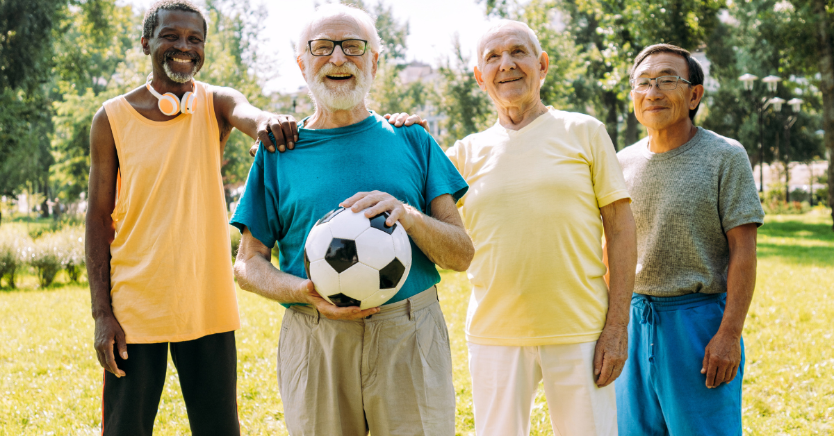 Group of active older men playing soccer